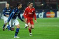 Fernando Torres and Cristian Chivu in action during the match